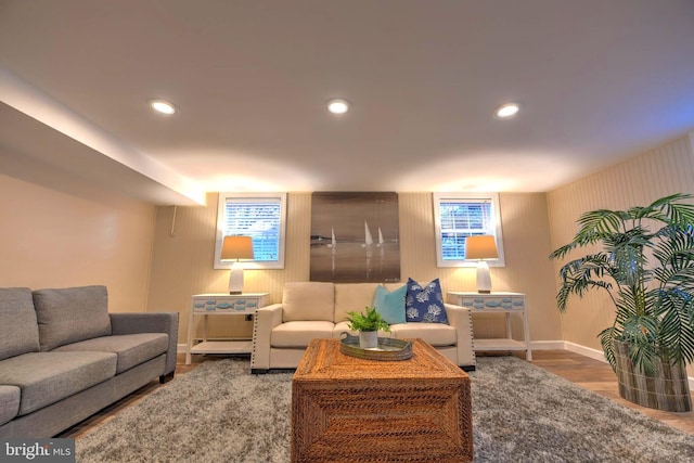 living room with hardwood / wood-style flooring and a healthy amount of sunlight