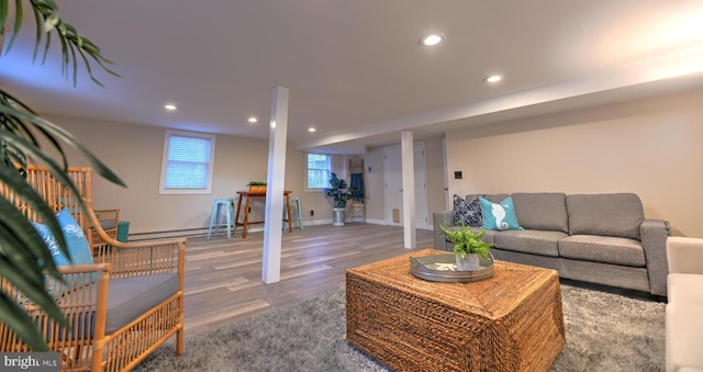 living room featuring hardwood / wood-style flooring and baseboard heating