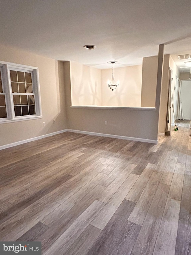 empty room featuring wood-type flooring