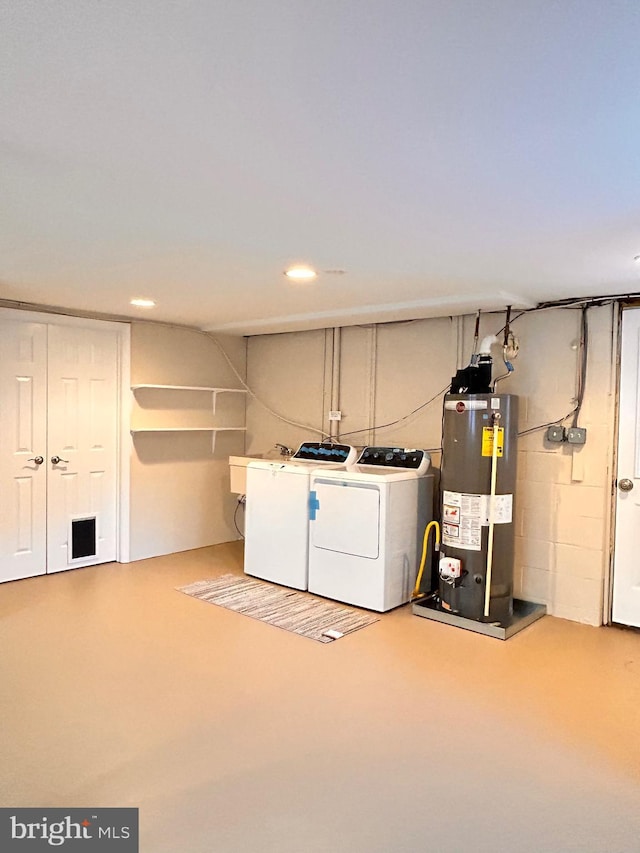 laundry room with washer and clothes dryer and gas water heater