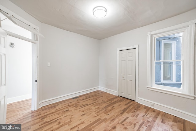 unfurnished room featuring light hardwood / wood-style flooring