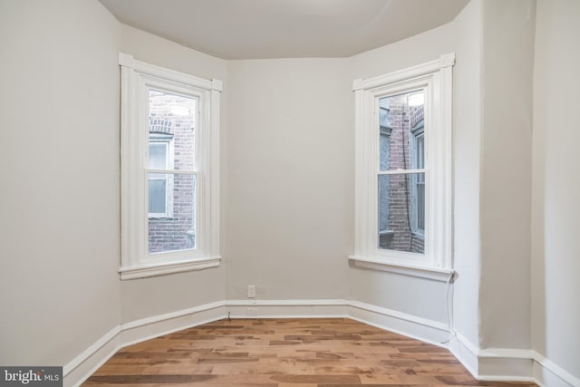 spare room with light wood-type flooring