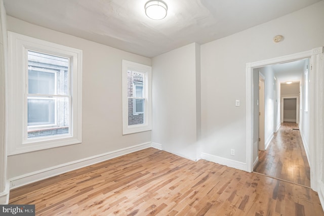 spare room featuring light hardwood / wood-style flooring