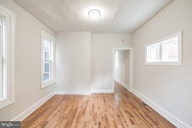 spare room with light wood-type flooring