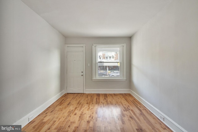 spare room featuring light hardwood / wood-style flooring