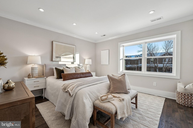 bedroom featuring dark hardwood / wood-style floors and crown molding