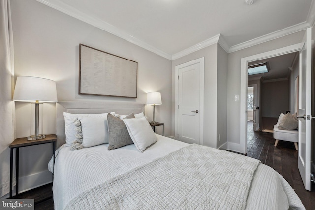 bedroom with crown molding and dark wood-type flooring