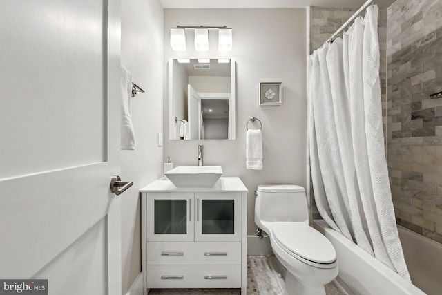 full bathroom featuring shower / bathtub combination with curtain, vanity, and toilet