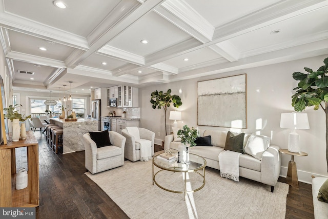 living room featuring beamed ceiling, ornamental molding, hardwood / wood-style flooring, and coffered ceiling