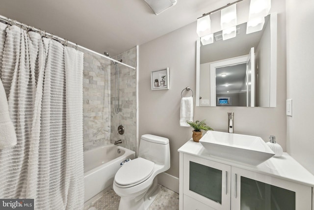 full bathroom with vanity, shower / tub combo, and toilet