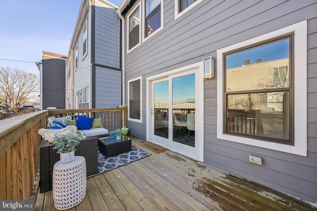 wooden deck featuring an outdoor hangout area