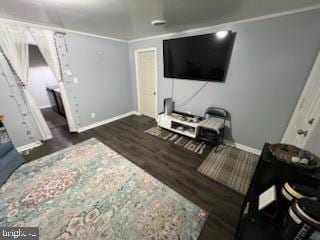 living room with ornamental molding and dark wood-type flooring