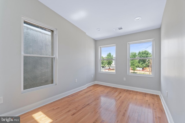 spare room featuring light hardwood / wood-style flooring