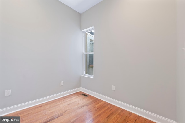 empty room with light hardwood / wood-style floors