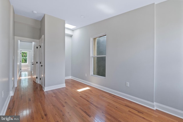 spare room featuring hardwood / wood-style flooring