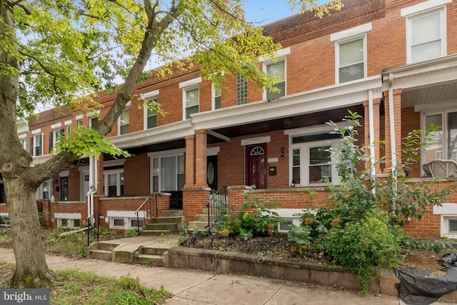 view of property featuring covered porch