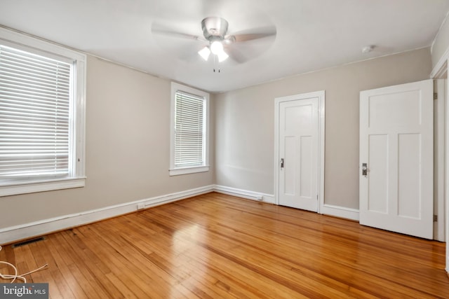 unfurnished bedroom with hardwood / wood-style floors and ceiling fan