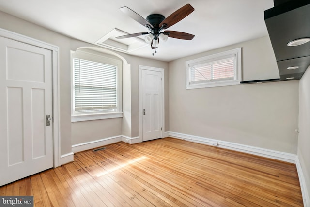 unfurnished bedroom featuring ceiling fan and light wood-type flooring