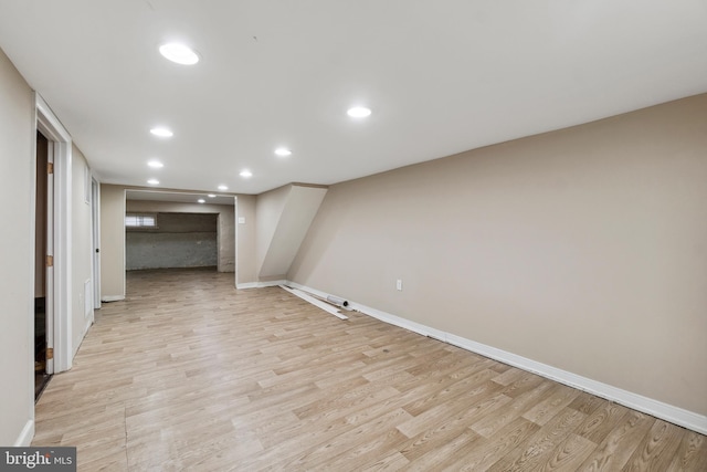 basement featuring light wood-type flooring