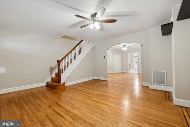 unfurnished living room with ceiling fan and light hardwood / wood-style flooring