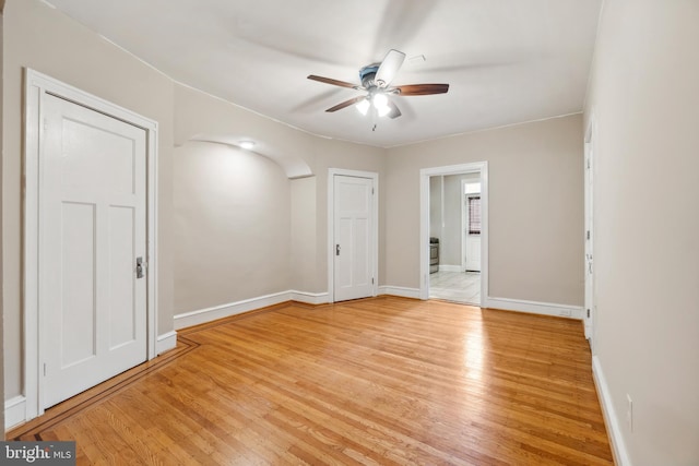 unfurnished room featuring ceiling fan and light wood-type flooring