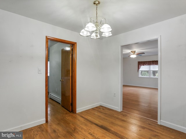64 W Walter Ave, Greencastle, PA 17225 - spare room featuring baseboard heating, a chandelier, wood finished floors, and baseboards