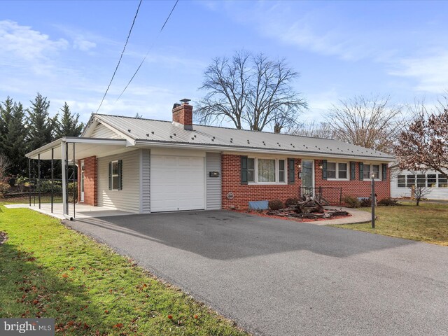 64 W Walter Ave, Greencastle, PA 17225 - single story home with a garage, asphalt driveway, brick siding, metal roof, and a front lawn