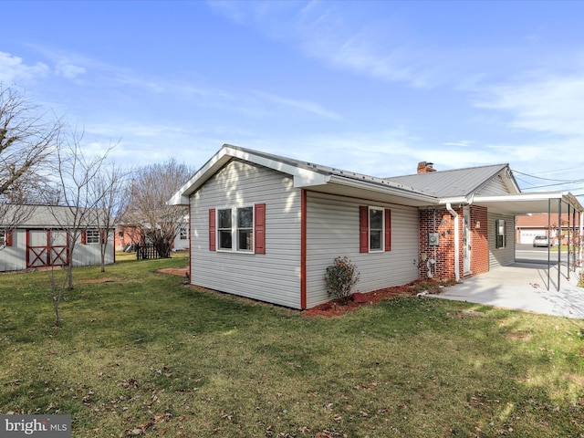 view of property exterior with a carport and a lawn