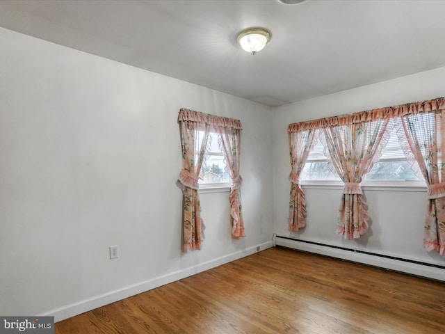 64 W Walter Ave, Greencastle, PA 17225 - unfurnished room featuring baseboards, baseboard heating, and wood finished floors