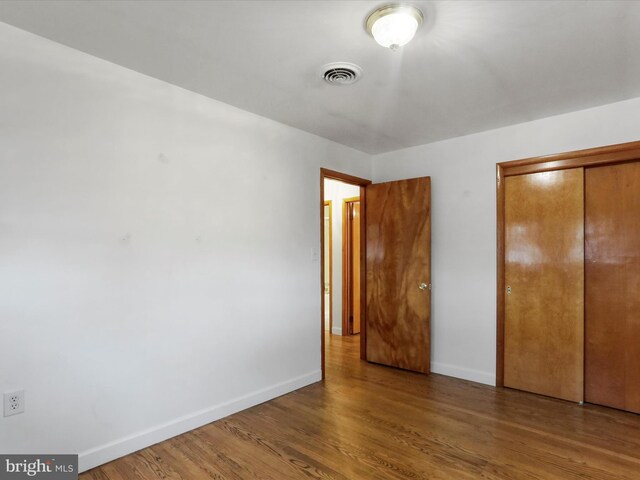 64 W Walter Ave, Greencastle, PA 17225 - unfurnished bedroom with baseboards, wood finished floors, and a closet