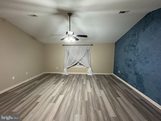 unfurnished room with hardwood / wood-style floors