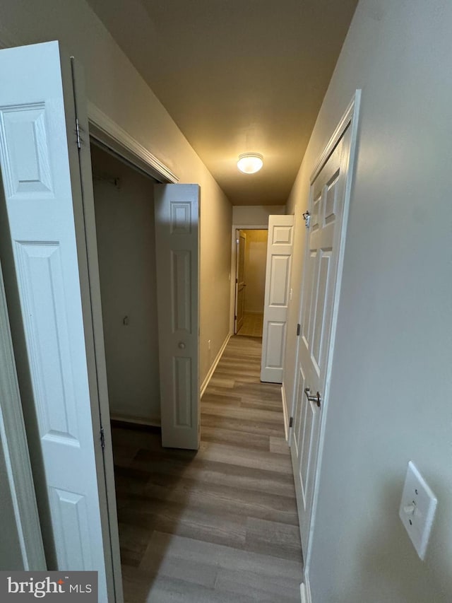 corridor featuring light hardwood / wood-style floors