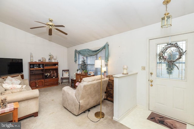 entrance foyer featuring a wealth of natural light, carpet floors, and ceiling fan