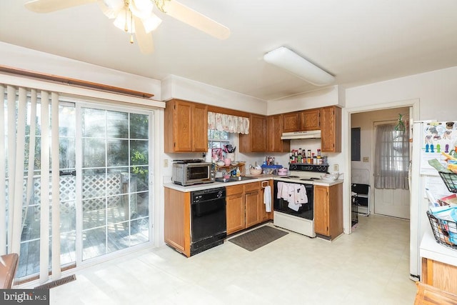 kitchen featuring ceiling fan, sink, a healthy amount of sunlight, and white appliances