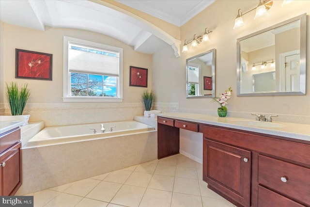 bathroom with ornamental molding, tile patterned floors, tiled tub, and vanity