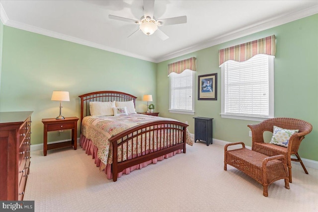 bedroom with ceiling fan, crown molding, and light colored carpet