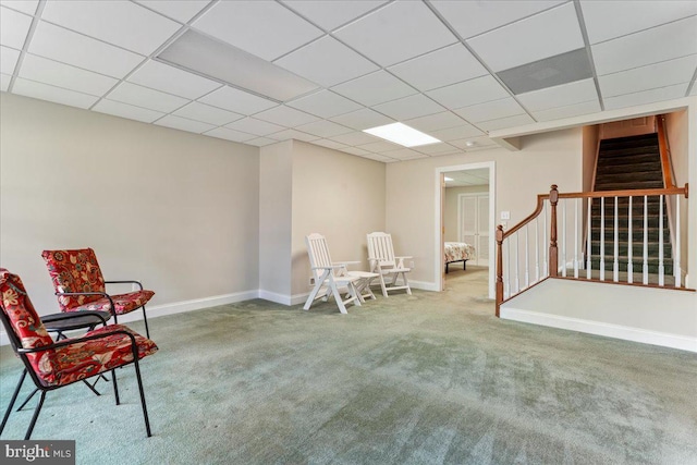 living area featuring carpet