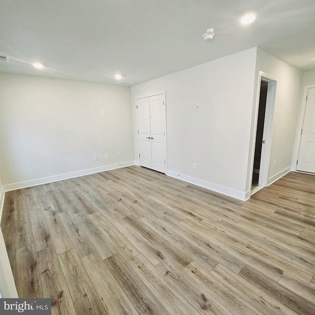 unfurnished room featuring light hardwood / wood-style floors