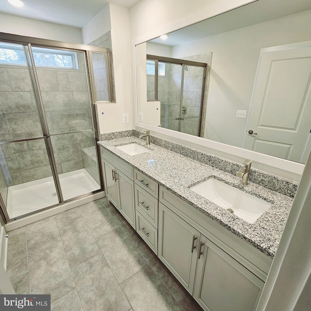 bathroom featuring tile patterned floors, vanity, and walk in shower