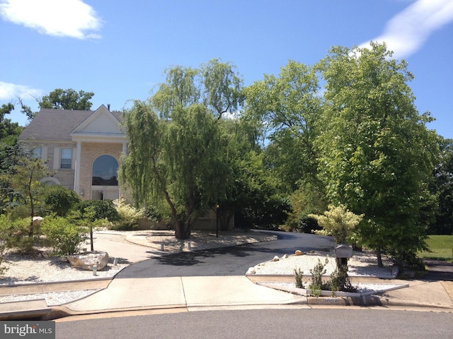 view of property hidden behind natural elements