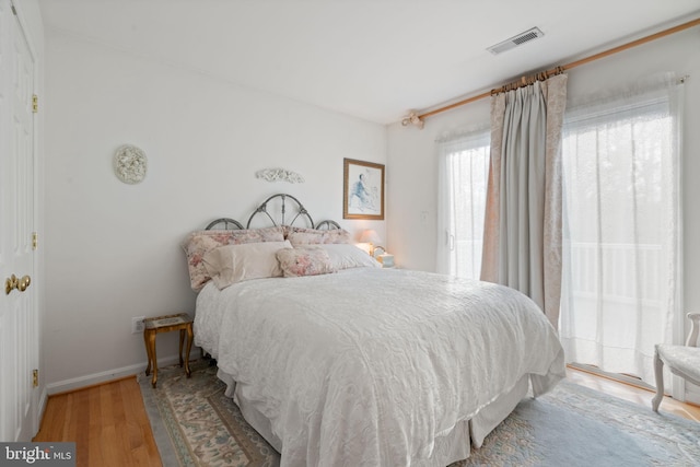 bedroom with light hardwood / wood-style floors