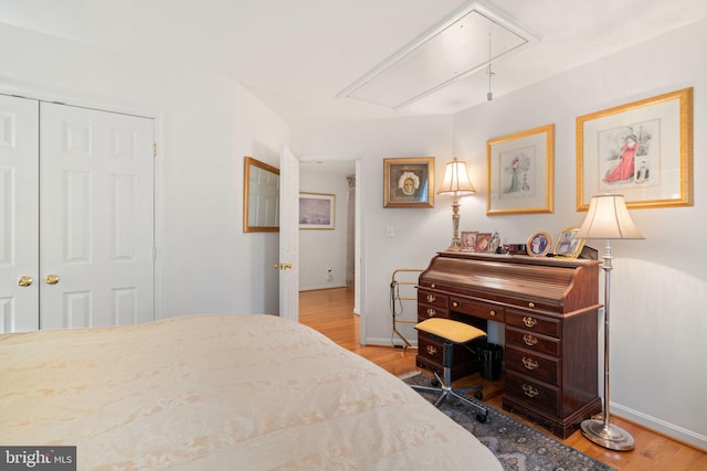 bedroom featuring a closet and light hardwood / wood-style flooring