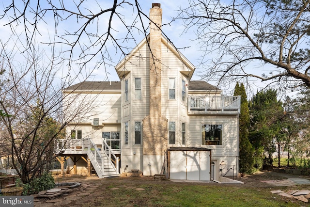 back of house featuring a balcony