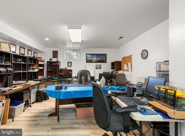 office with light wood-type flooring