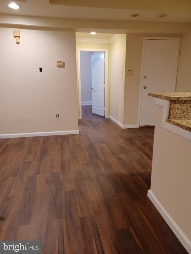 hallway with dark hardwood / wood-style floors