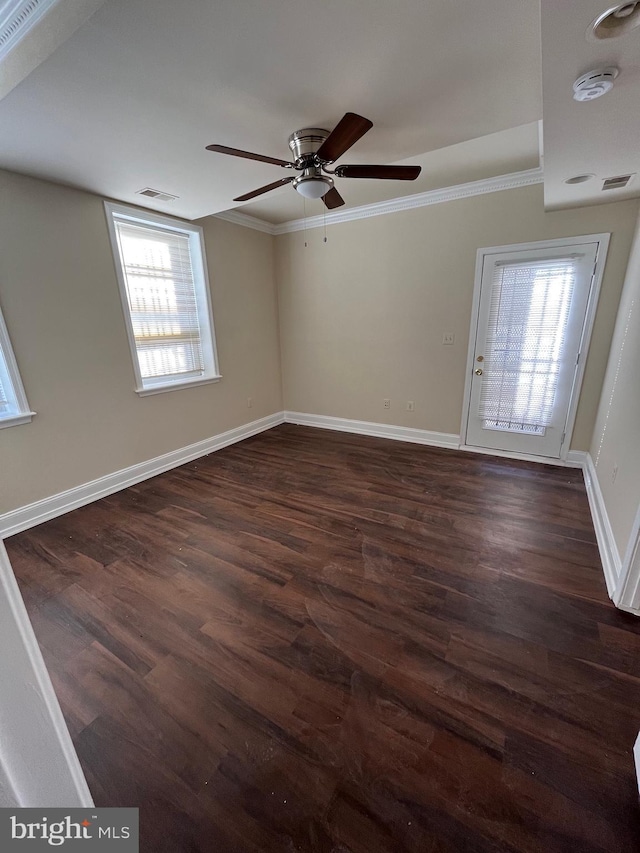 interior space featuring ceiling fan, dark hardwood / wood-style flooring, and ornamental molding