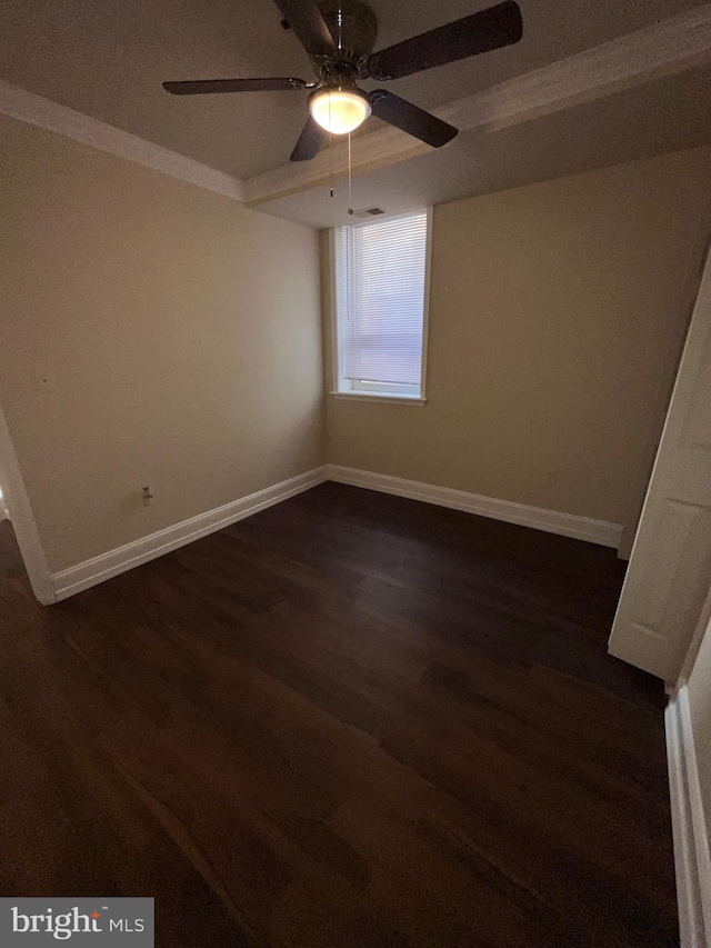 unfurnished room with ceiling fan, ornamental molding, and dark wood-type flooring