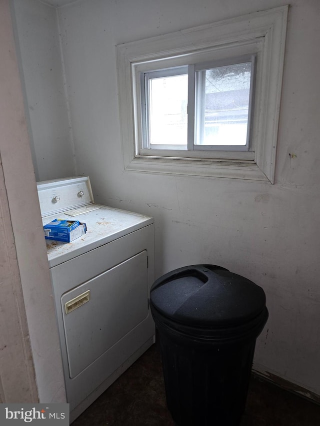 clothes washing area with washer / dryer