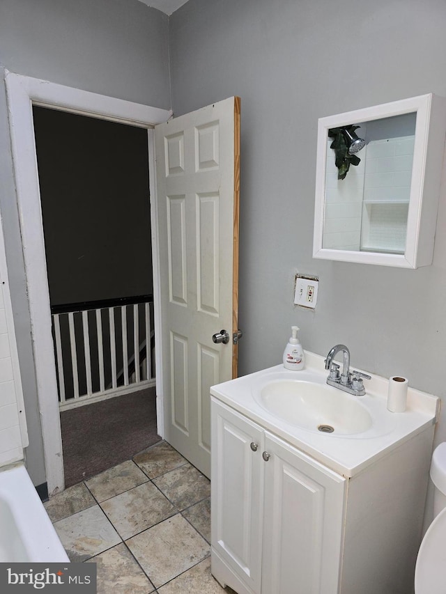 bathroom with vanity and toilet