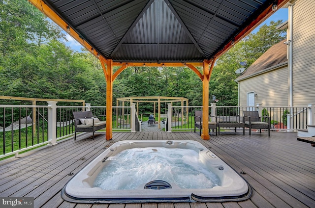 wooden deck featuring a gazebo